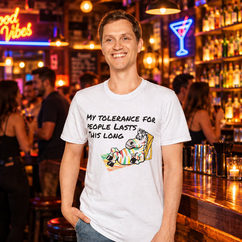 t-shirt featuring a cartoon rainbow-striped zebra in a beach chair with the text "My Tolerance For People Lasts This Long" in an 80s retro style.
