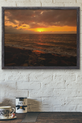  art print showing a rocky beach at sunset over the ocean