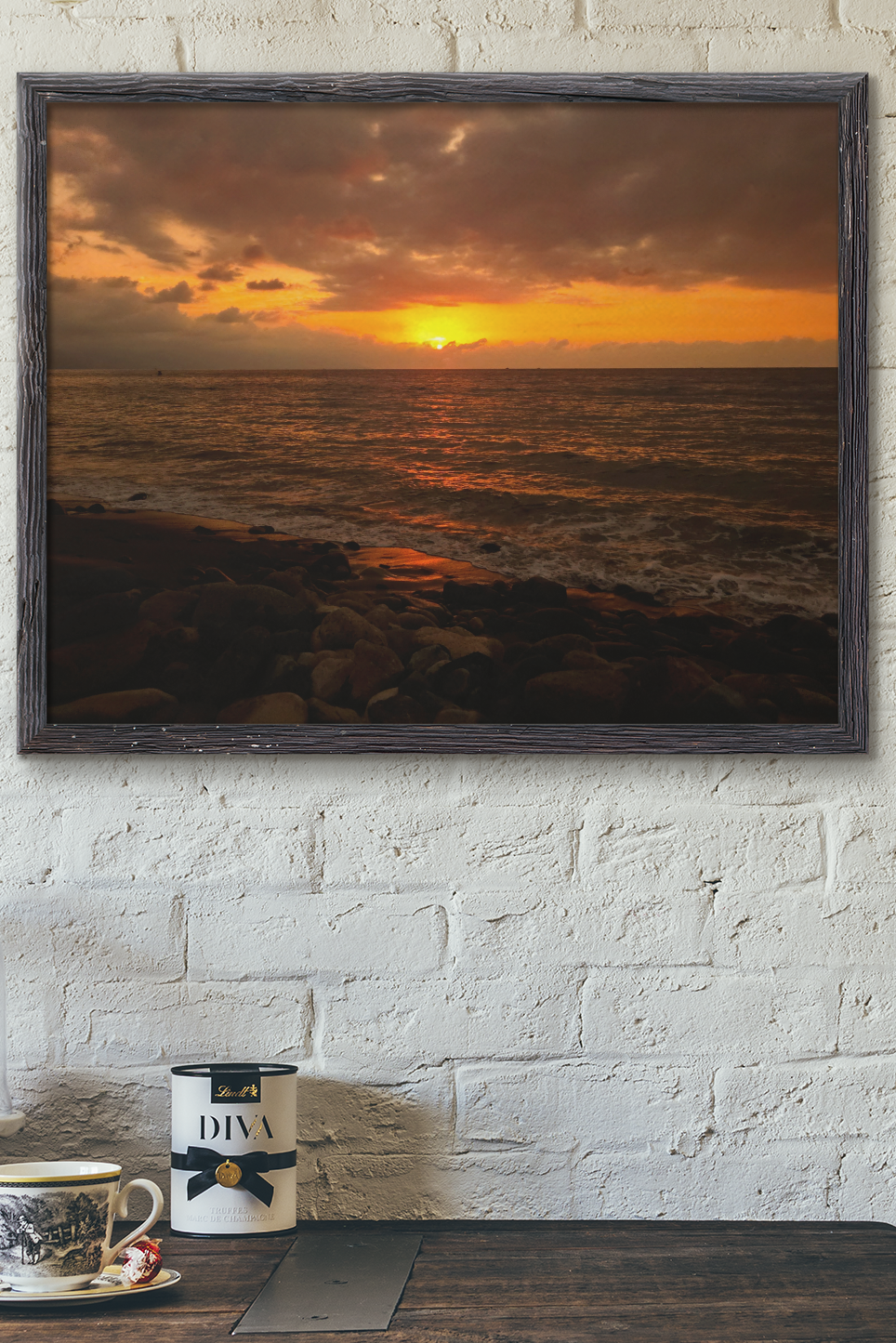  art print showing a rocky beach at sunset over the ocean