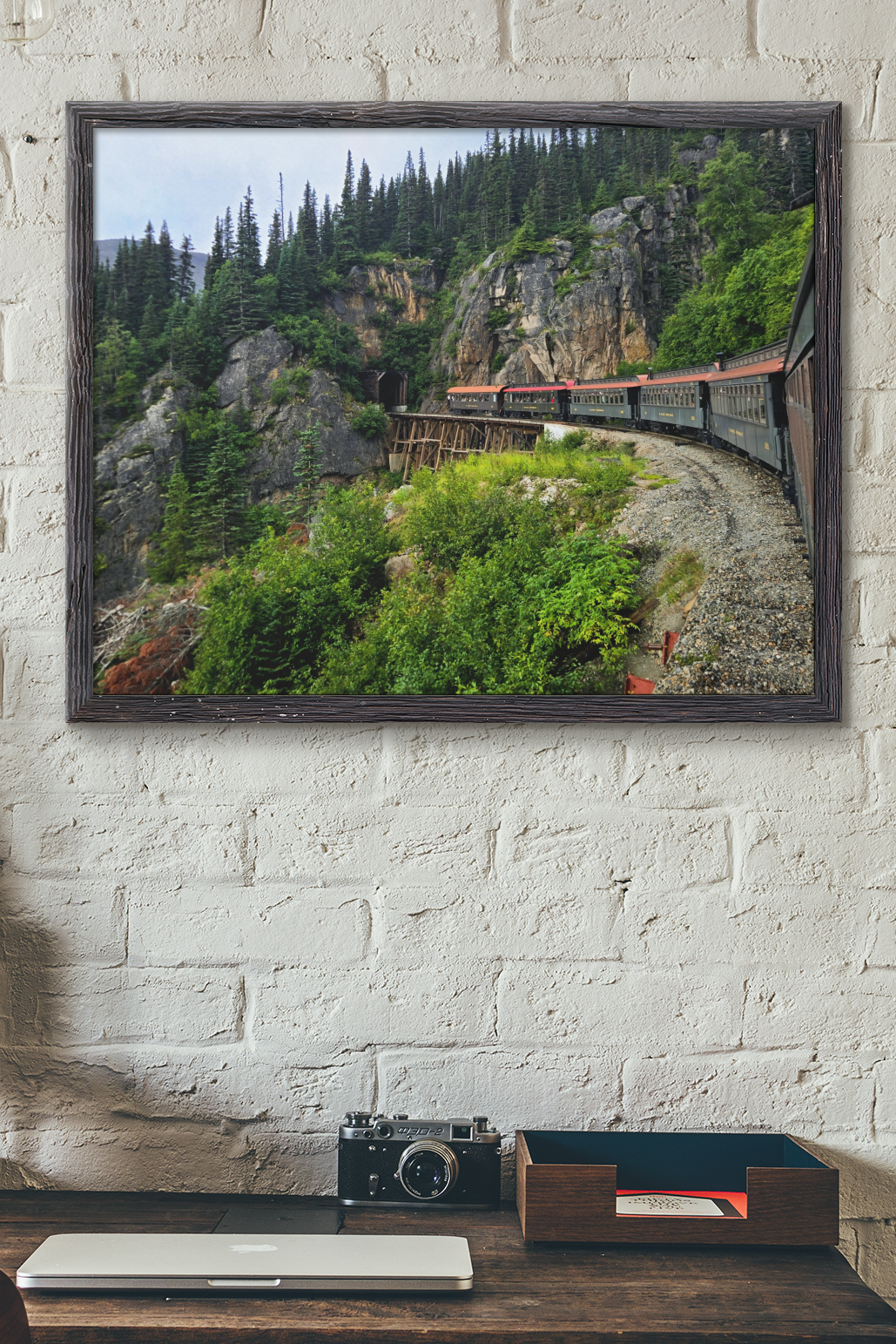 Fine art photography print of the White Pass and Yukon Route Railway train crossing a wooden trestle bridge in Skagway Alaska.