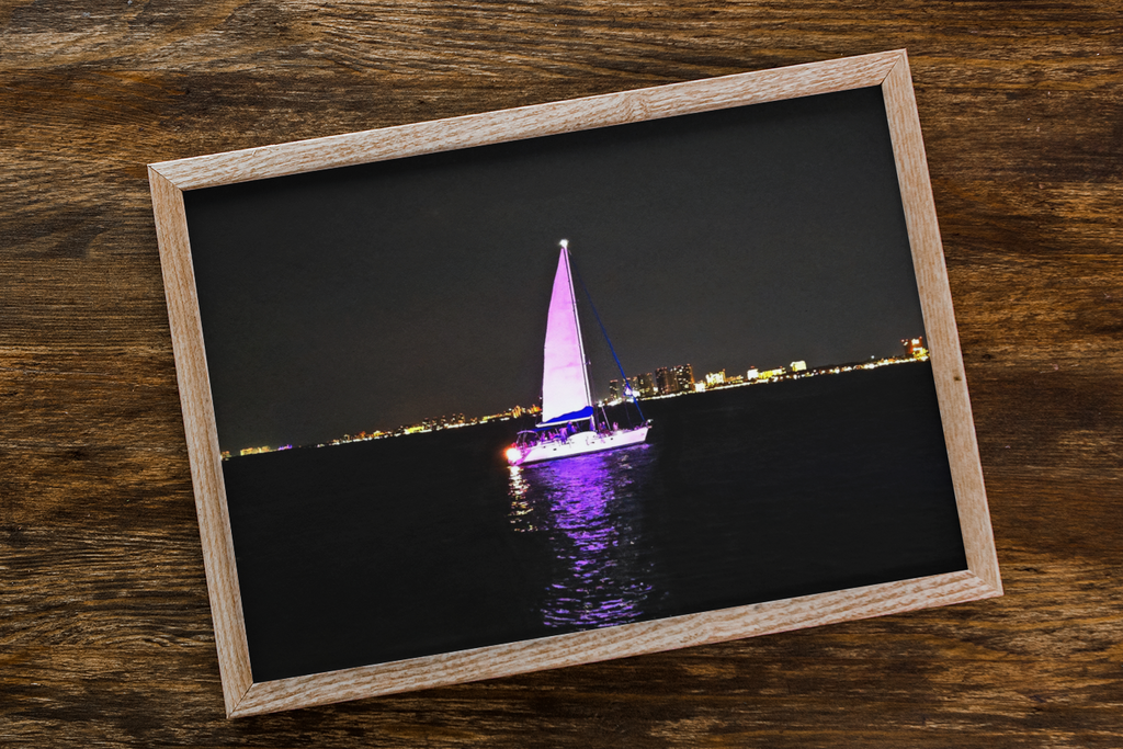 Illuminated Sailboat at Night Photo Print | Purple Glowing Sailboat Wall Art | Nighttime City Skyline Ocean Photography | Modern Nautical Decor
