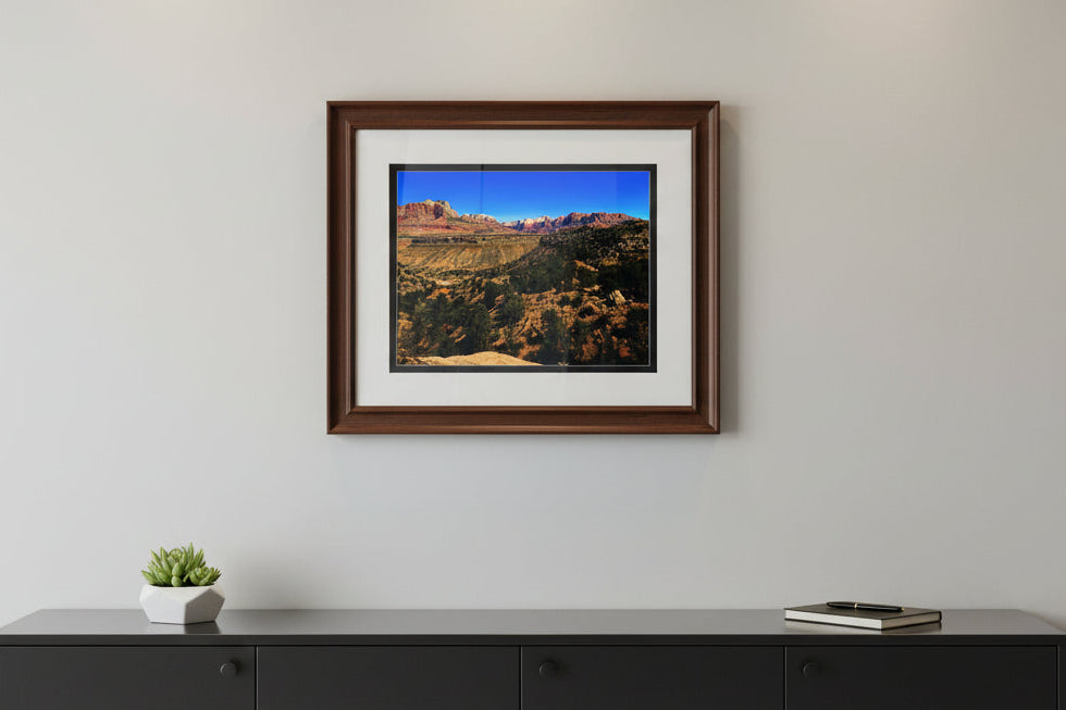 Fine art landscape photo print of red rock sandstone mesas and canyon vista under a blue sky in Zion National Park, Utah.
