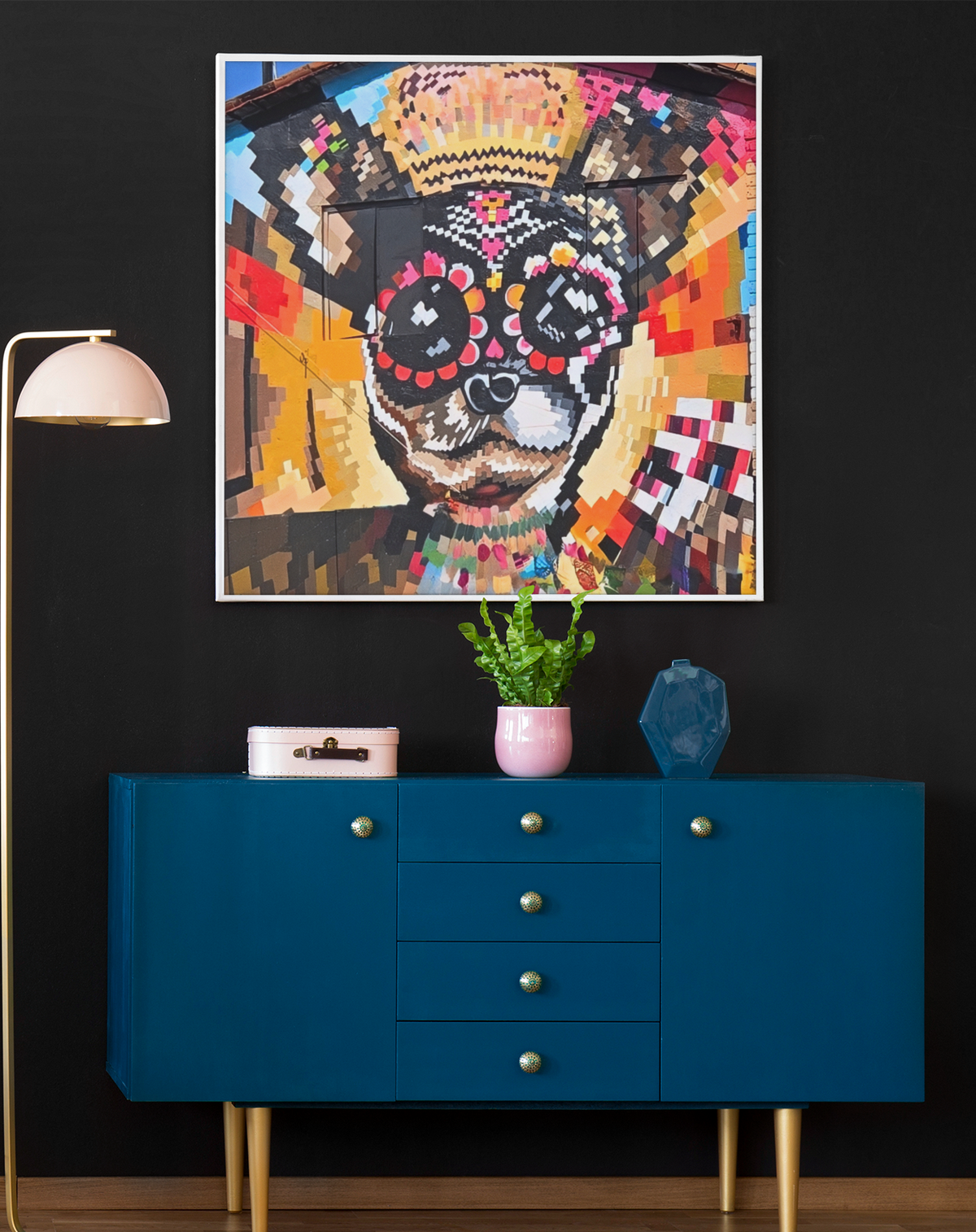 Fine art photograph of a colorful pixelated sugar skull building mural with a gold crown, mosaic halo, and vibrant street art patterns.